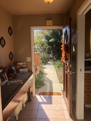 view from inside the cottage of the outdoor walkway