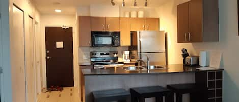 Fully equipped kitchen with stainless steel appliances