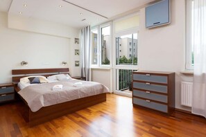 The cosy bedroom features a luxurious double bed and ample storage. 