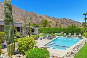 Saltwater pool, spa and plenty of lounge chairs