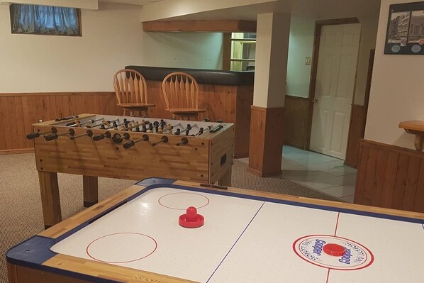 The Man Cave offers your own bar, gaming tables and a second large flat screen tv... there is something for everyone to stay entertained during your stay. Rest a beverage on the handy shelves and GAME ON!