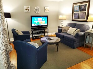 Livingroom offers room to stretch out and relax, or to share the space your companions.