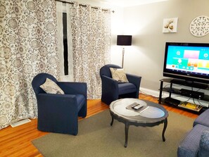 There is a comfy seating area with loveseat and two armchairs. Have a seat and relax.