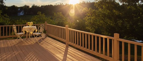 Deck with patio seating to take in mountain views.