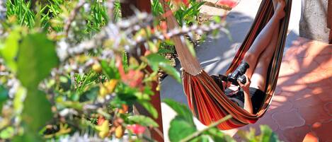 Enjoy our hammocks + a cool drink in our next door garden cafe