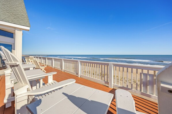 Soak up the sun at Southern Sol, a 7-bedroom oceanfront home filled with luxurious amenities.