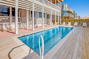 Watch the waves while you splash in the pool in or relax in the poolside seating area.