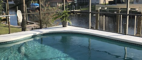 Pool area over looking salt water canal 