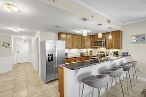 Full Size Kitchen with Granite Countertops, Stainless Steel Appliances and Extra Seating at the Breakfast Bar