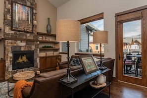 Cozy up by the gas fireplace or head out to the deck to catch the alpenglow views