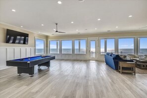 Challenge guests to a game of pool after beach time.