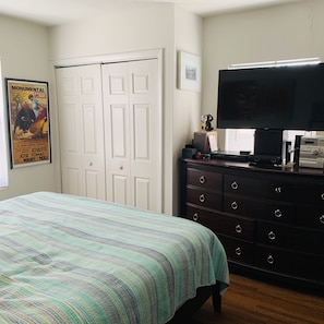 Bedroom with Smart TV with DVD player and surround sound