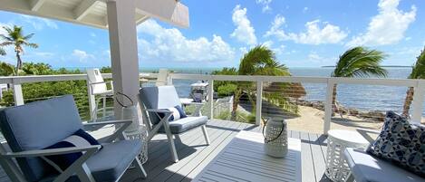 Breezy beachfront from 2nd floor deck overlooking the ocean