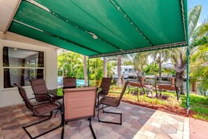 Breezy shaded area with table for six 