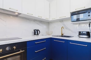 Prepare meals with ease in the kitchen's functional layout.