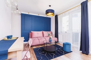 The living room's modern and stylish decor creates a welcoming and atmosphere.