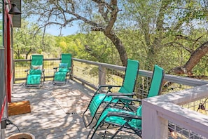 Abundant deck seating right in the trees.