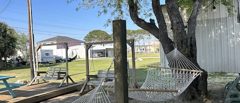 Relax on the hammocks in the Rather Be Fishin’ backyard Biergarten 