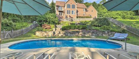 Head down the sloped yard to the private pool area, where you can lounge & swim!