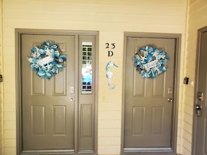 The front door to the left is your entrance to the first floor 2 BR, 2 bath unit