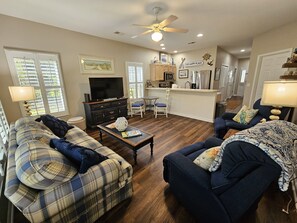 Open living, dining and kitchen space with new flooring, paint and furnishings! 