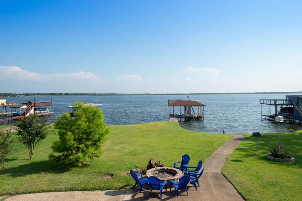 Views of the yard and lake from the balcony.