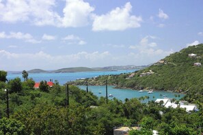 The view from your upper deck overlooking Great Cruz Bay Harbor, Pillsbury Sound and St Thomas. In the early evening this westerly view becomes a majestic sunset