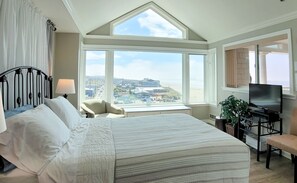 Master Bedroom with queen bed, 36" SmartTV and a wall of panoramic windows
