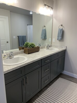 Master bathroom. Body wash & hand soap provided.
Linen closet with extra towels