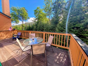 The outdoor area is a back deck accessed from the main level living area.