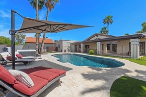 Pool, hot tub and rear patio with umbrella