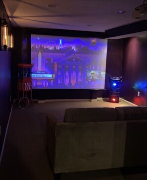 Media Room with 120” screen, karaoke machine. Connected to rec room with bar 