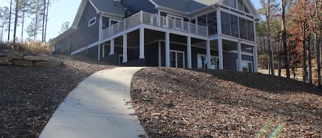 Back of house, lots of windows with view of the lake