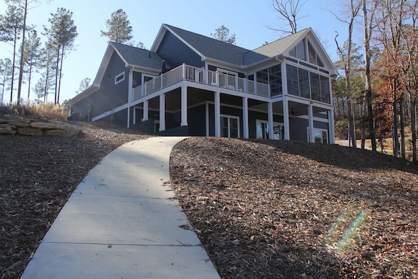 Back of house, lots of windows with view of the lake