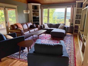 Family Room with wood burning fireplace & a view of the mountains