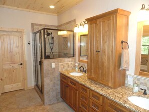 Master bath with shower and separate jacuzzi bathtub