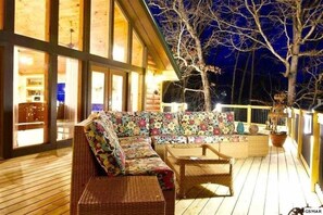 Upper tiered deck with lovely seating and lighting.  