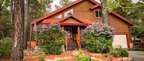 Home is nestled in the trees with a lovely mountain feel.