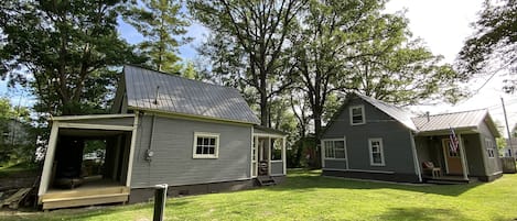 Boat house on the left and main house on the right and secluded back yard