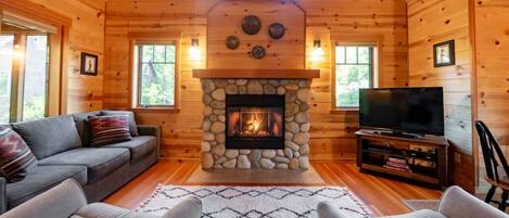 Cozy living room with river rock gas fireplace