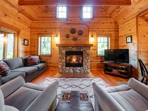 Cozy living room with river rock gas fireplace