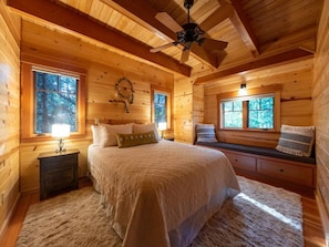 Master bedroom with queen bed and river views