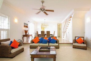 The large open living / dining room has lots of space and bright natural light