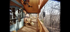Beautiful outdoor deck with hammock, table and chairs and loungers for enjoyment