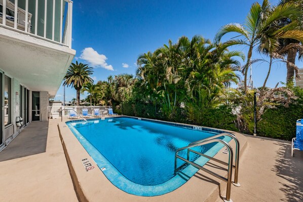 Pool starts at 4 ft, goes to 6.5 ft. Stairs at shallow end, ladder at deep end.