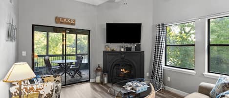 Bright & Clean Living Room just off the Dining Area has a Flat Screen TV 