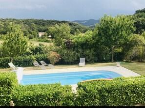 The swimming pool and fields. View from the master and queen bedroom. 