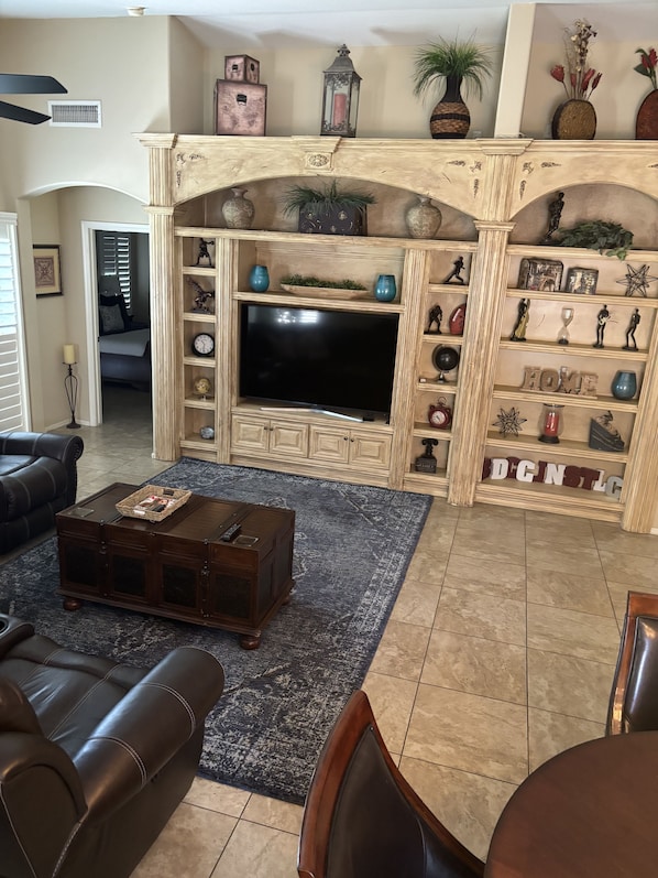 Family room, vaulted ceiling with 65" tv