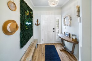 Feel at home from the moment you enter with a cozy, beachy vibe at the entryway.