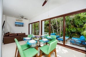 Dining room with garden and living room view